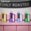 ELE World FOR PLUS 50000 Puffs (50k) disposable vape starter kit collection with multiple colors lined up on a pink background.