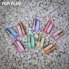 Multiple flavors and color variants of ELE World FOR PLUS 50000 Puffs 50k disposable vapes arranged in a fan shape on white stones.
