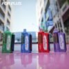 Various colors of FOR PLUS 50000 Puffs 50k disposable vapes placed outdoor on a car hood with street reflections.