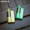 Yellow and green options of FOR PLUS 50000 Puffs 50k disposable vape starter kits on a wooden background.