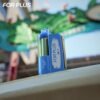 Blue color model of ELE World FOR PLUS 50000 Puffs 50k disposable vape device close up shot outdoors.
