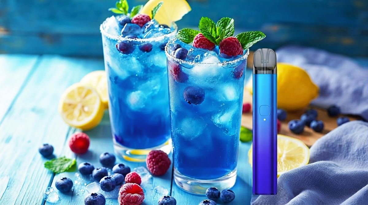 Blue Razz disposable vape device displayed next to refreshing blue raspberry slushie drinks with fresh blueberries and raspberries.